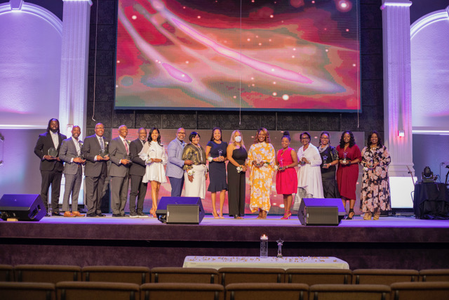 Honorees gathered on stage at an AAWHMP ceremony